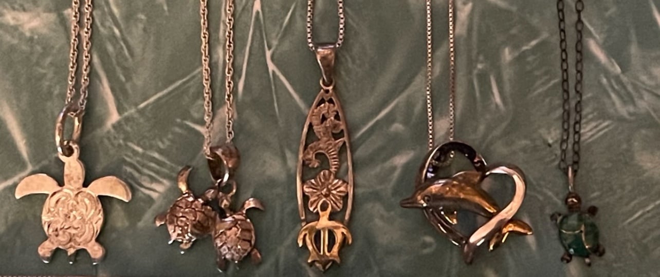 Bundle of small silver turtle & dolphin pendants necklaces & chains
