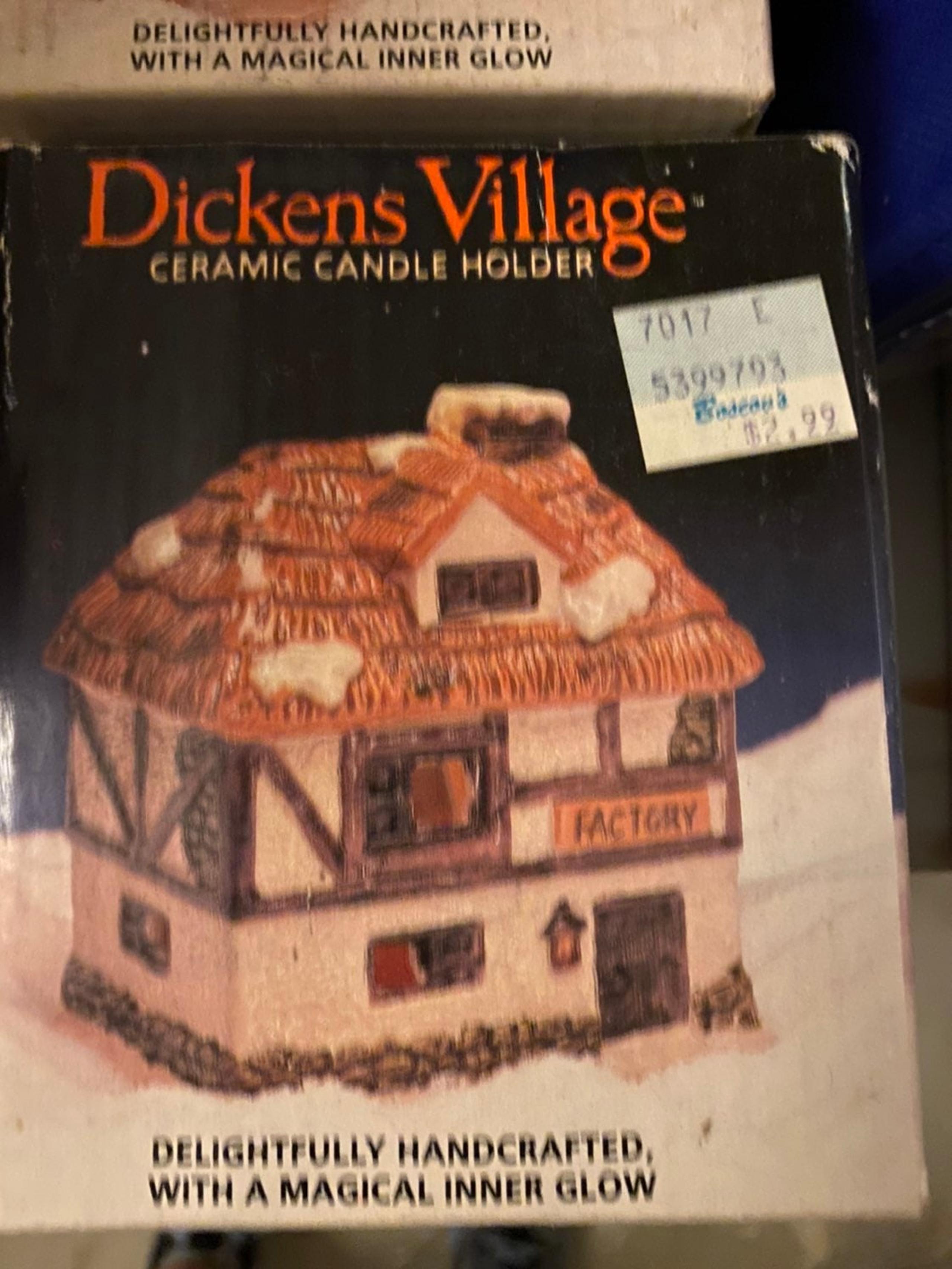 2 Dickens village ceramic candle holders