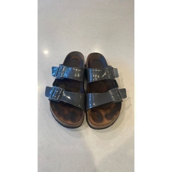 Birkenstock women’s shoes size 40, gray shiny leather soles in great shape.