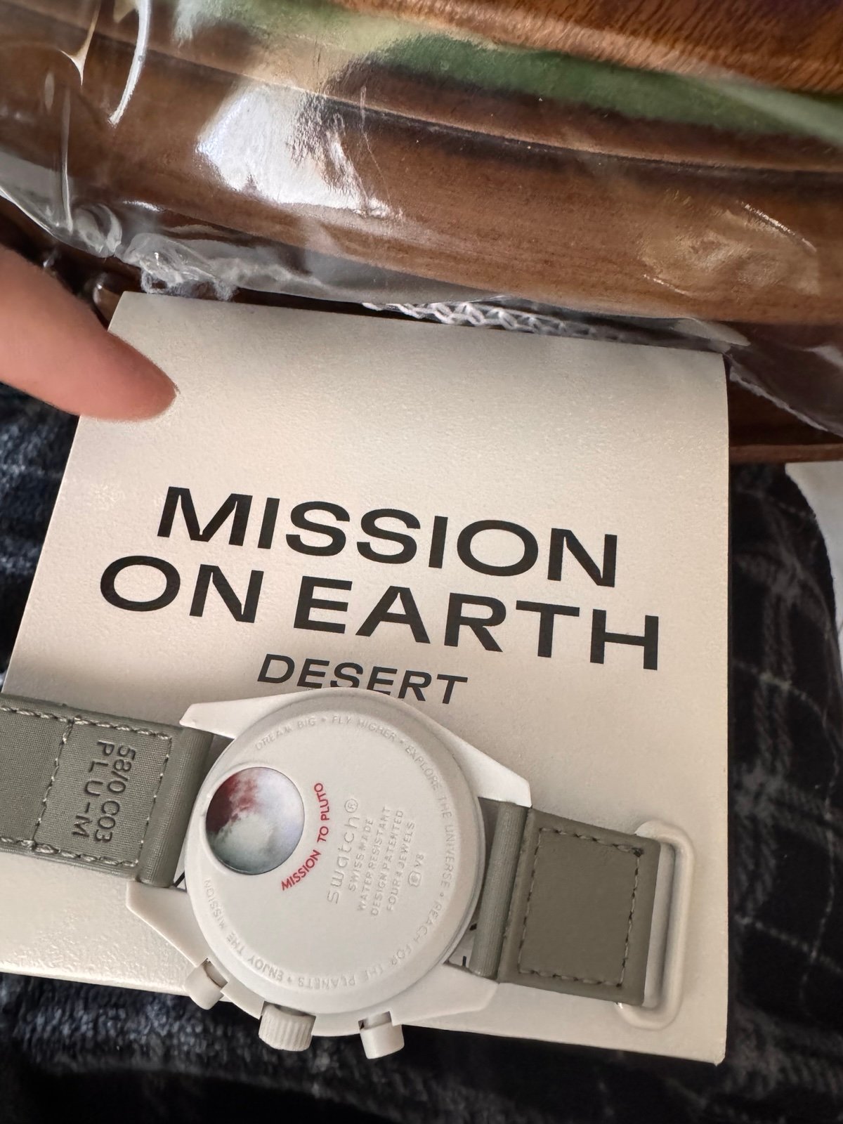 Omega Swatch mission to PLUTO