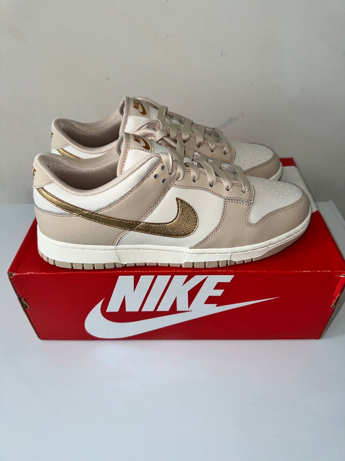 Nike dunk low gold swoosh “Phantom Gold”