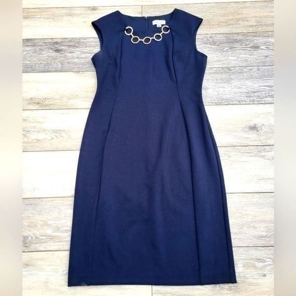 Calvin Klein navy sheath dress size 6 with gold colored chain at neckline midi