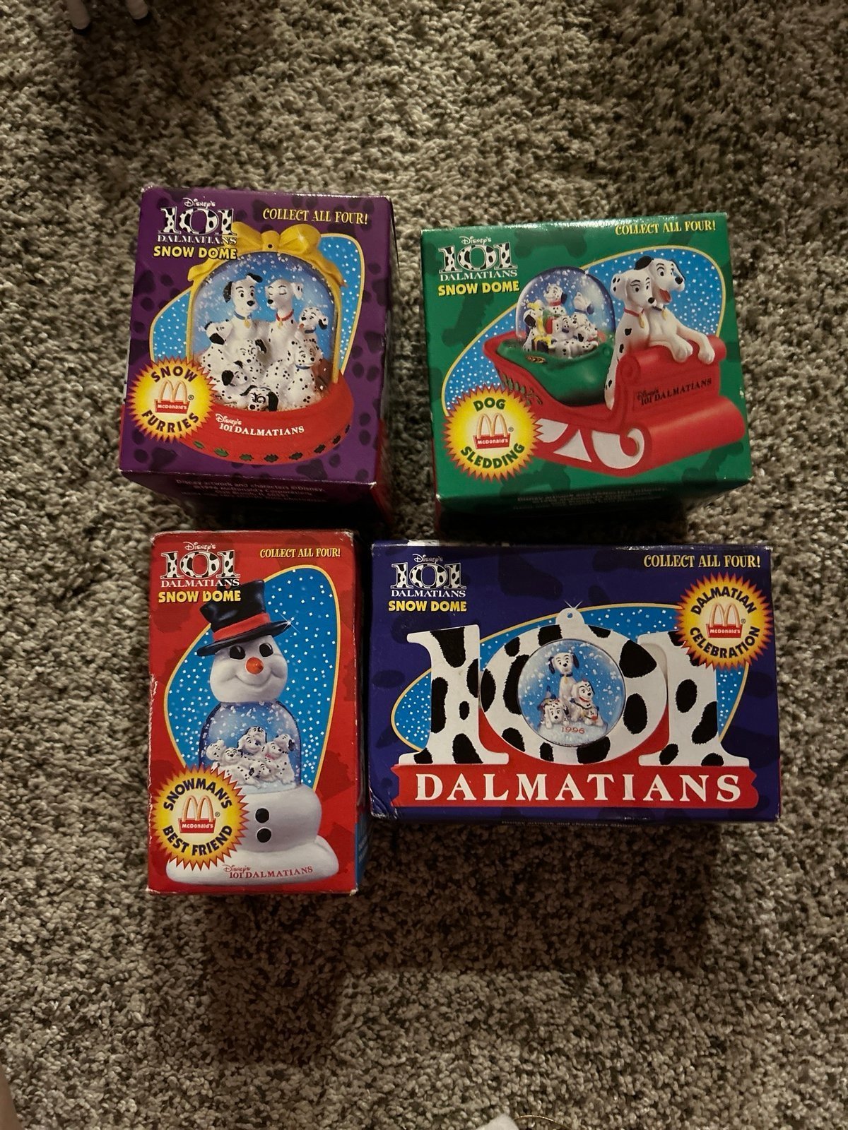 Brand new set 4 101 dalmatians McDonald’s snow globes