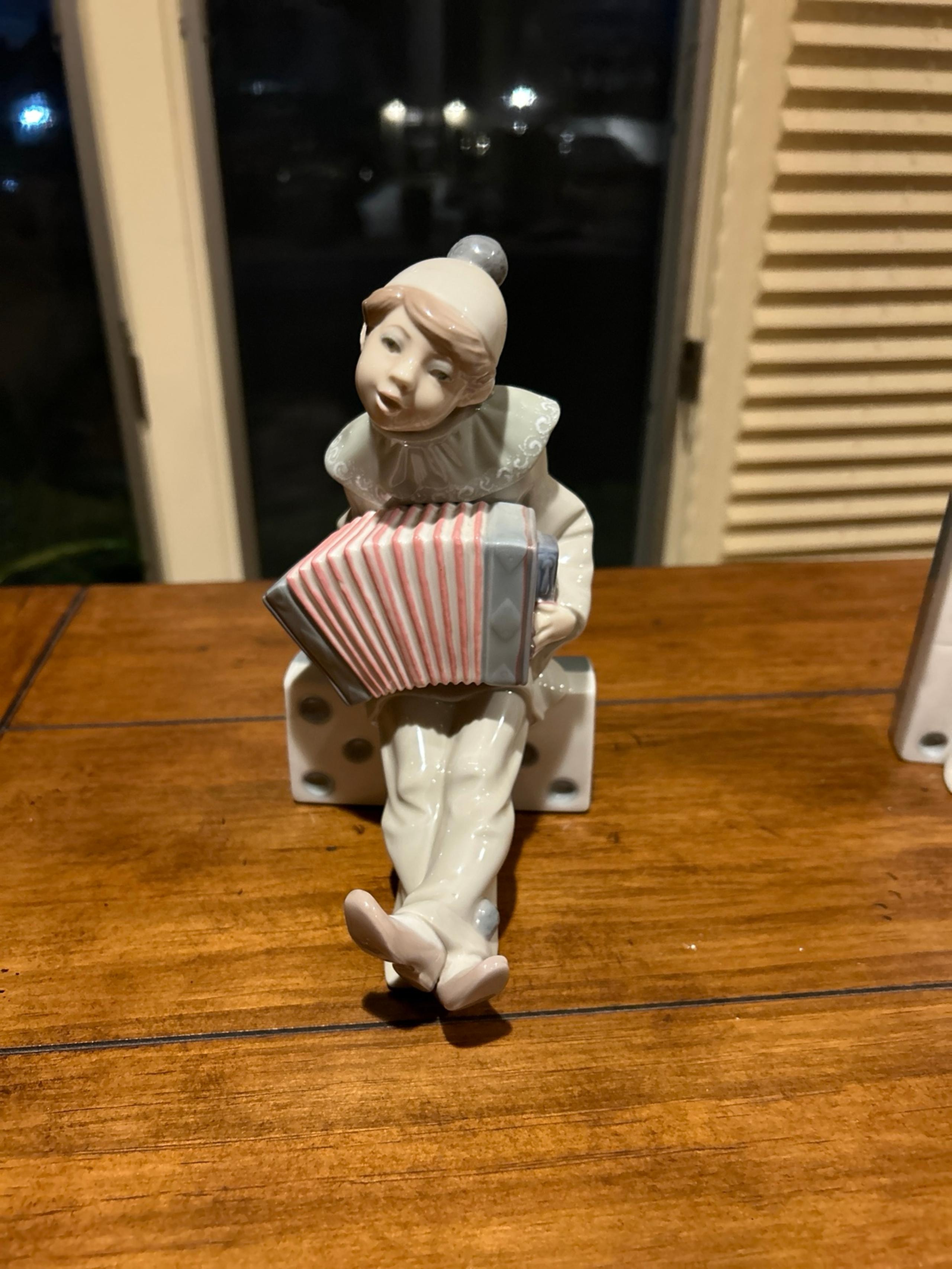 Lladro Retired Figurine boy on domino with Accordion