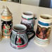 FOUR COLLECTIBLE BEER MUGS