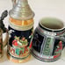 FOUR COLLECTIBLE BEER MUGS