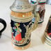 FOUR COLLECTIBLE BEER MUGS