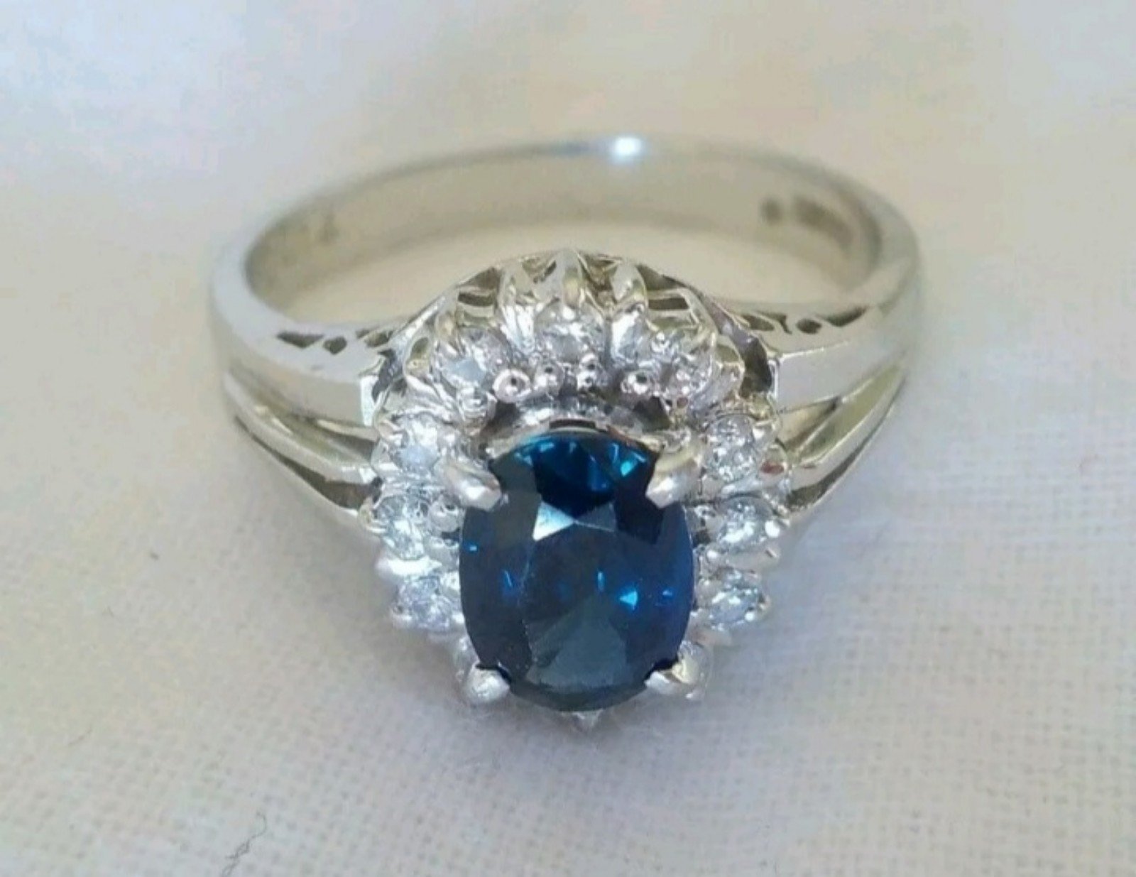 Solid platinum 900 Genuine natural blue sapphire and diamond halo ring.. size 6.