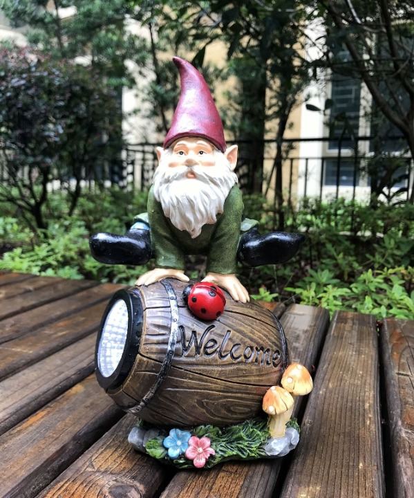 Solar Powered Gnome Jumping Over a Barrel with Ladybug LED Garden Light