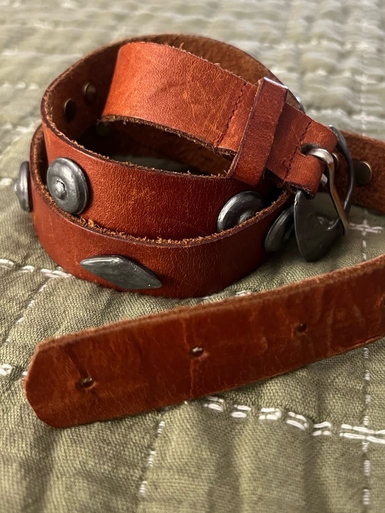 Leather belt with hand-made silver rivets