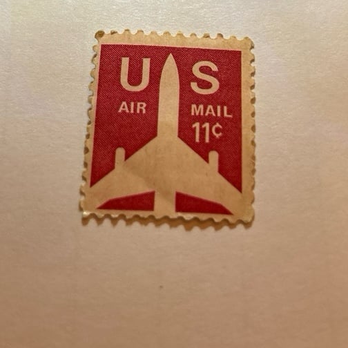 Stamp An .11 cent air mail stamp jet plane