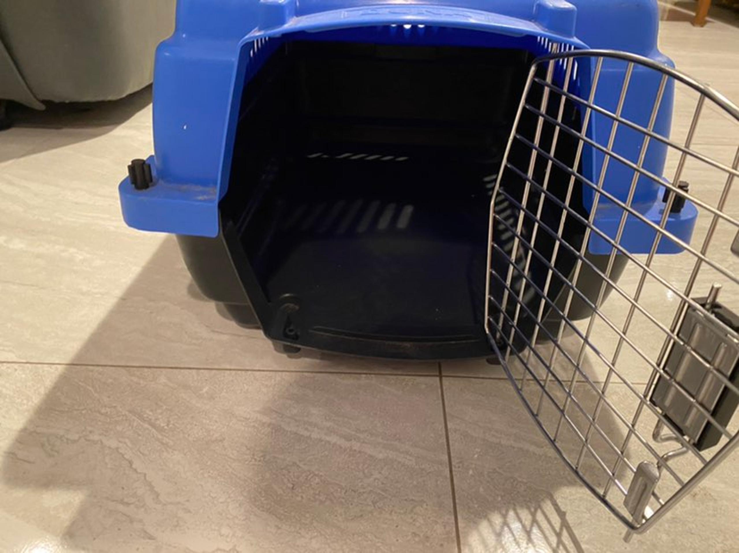 A blue dog cage