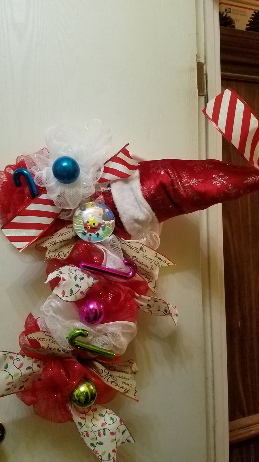 This listing is a wreath that I made on a candy cane wire wreath frame. My litt