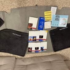 New Original Toyota Prius (2010) 5 car mats and car manuals – unused