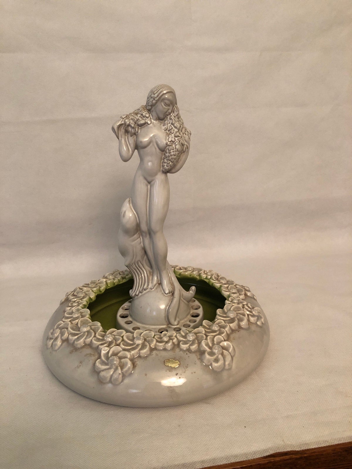 Vintage Royal Haeger nude and seal Flower frog/bowl.