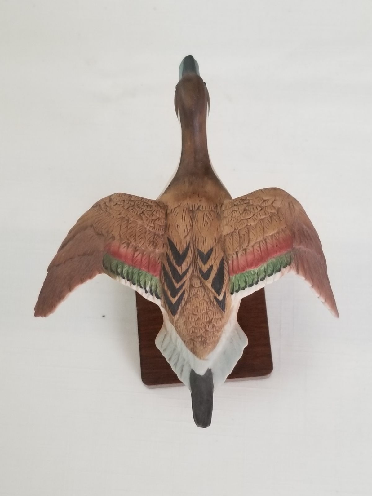 Vintage bird figurines on wooden stand Collectibles