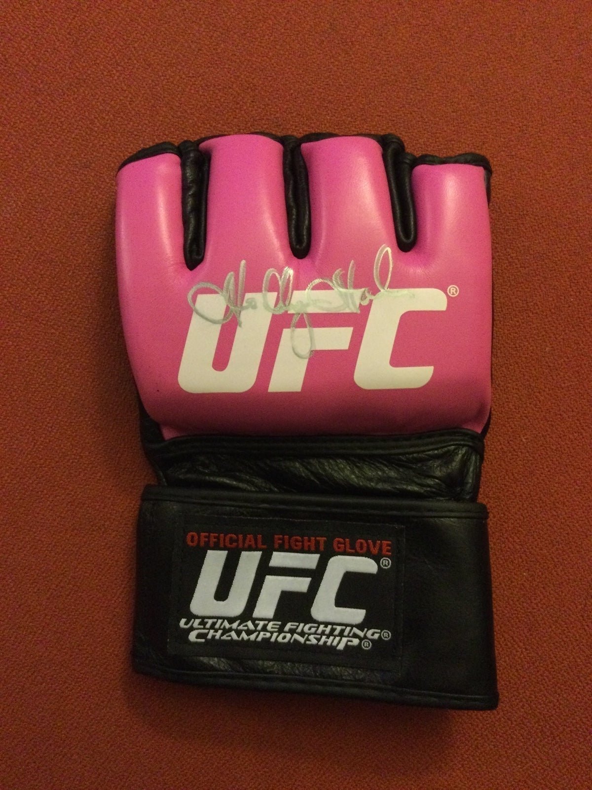 Holly Holm signed official ufc fight glove in pink.