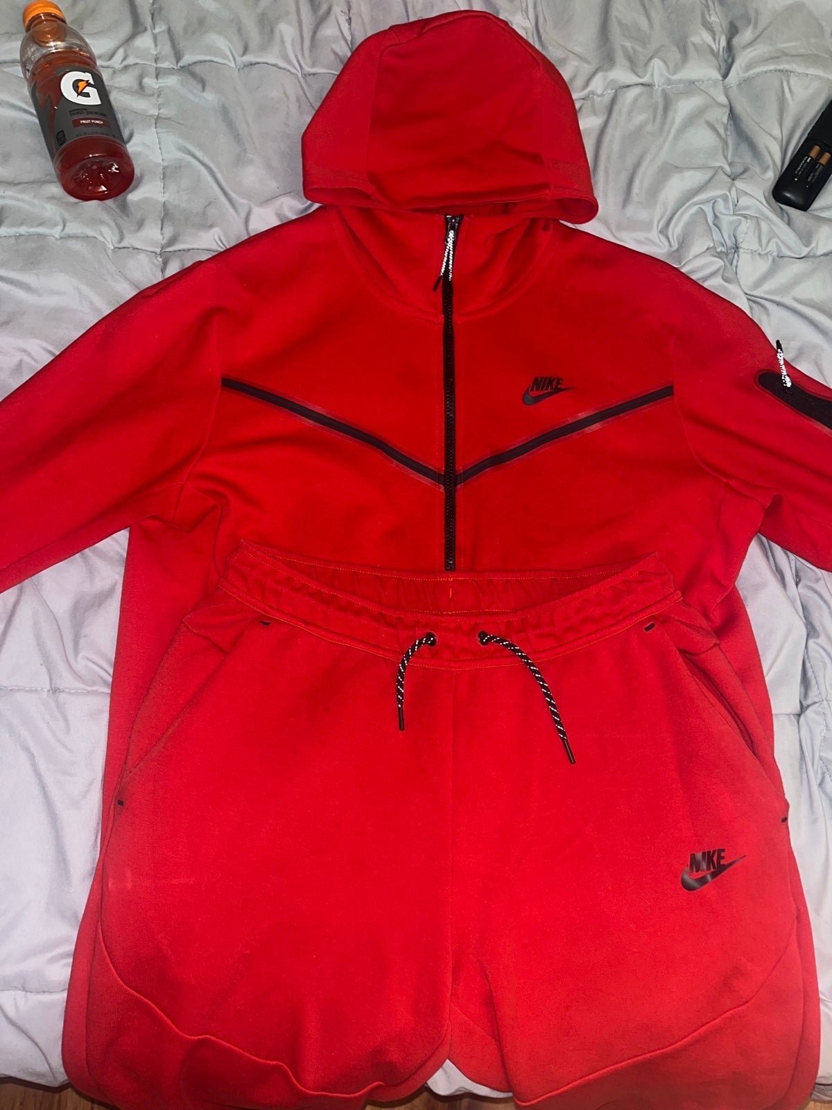 Red Nike tech sweatsuit