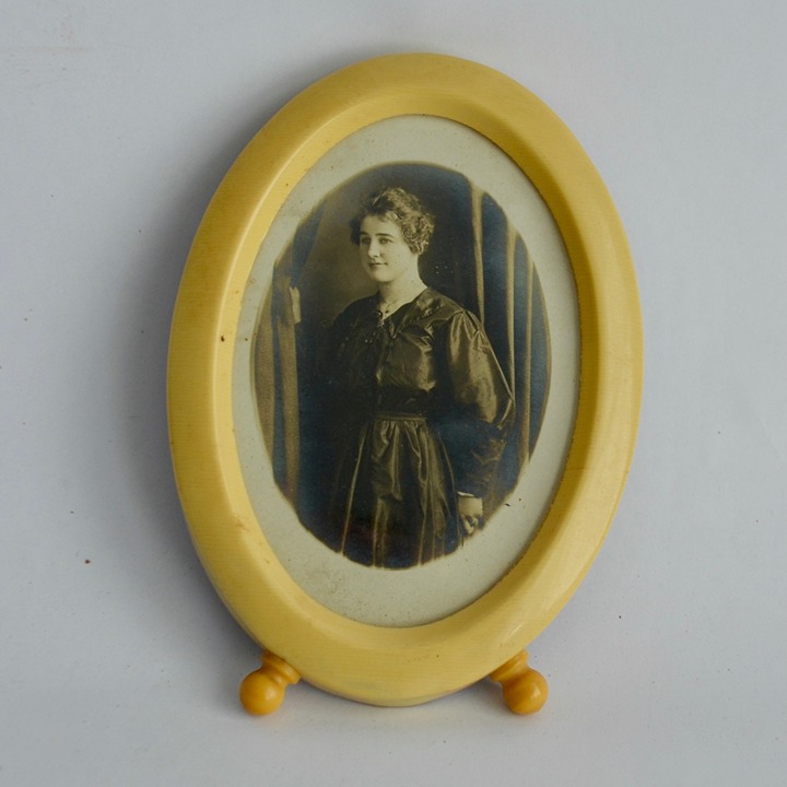 Vintage Celluloid Oval Footed Picture Frame with Antique Photo of Woman in Black