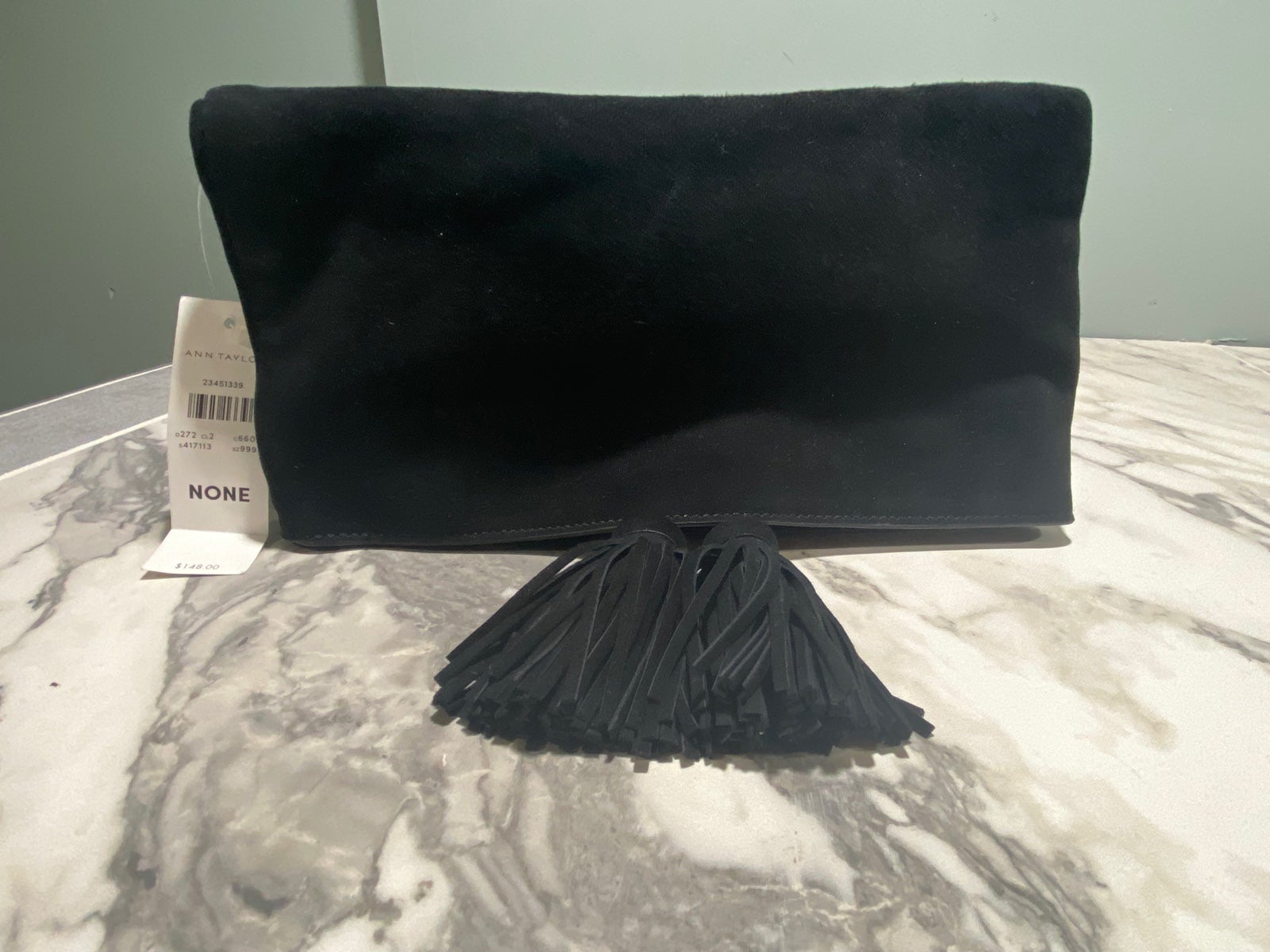 Suede Foldover Tassel Clutch In Black