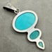 Charles Albert Sterling Silver and Turquoise Colored Gemstone Pendant