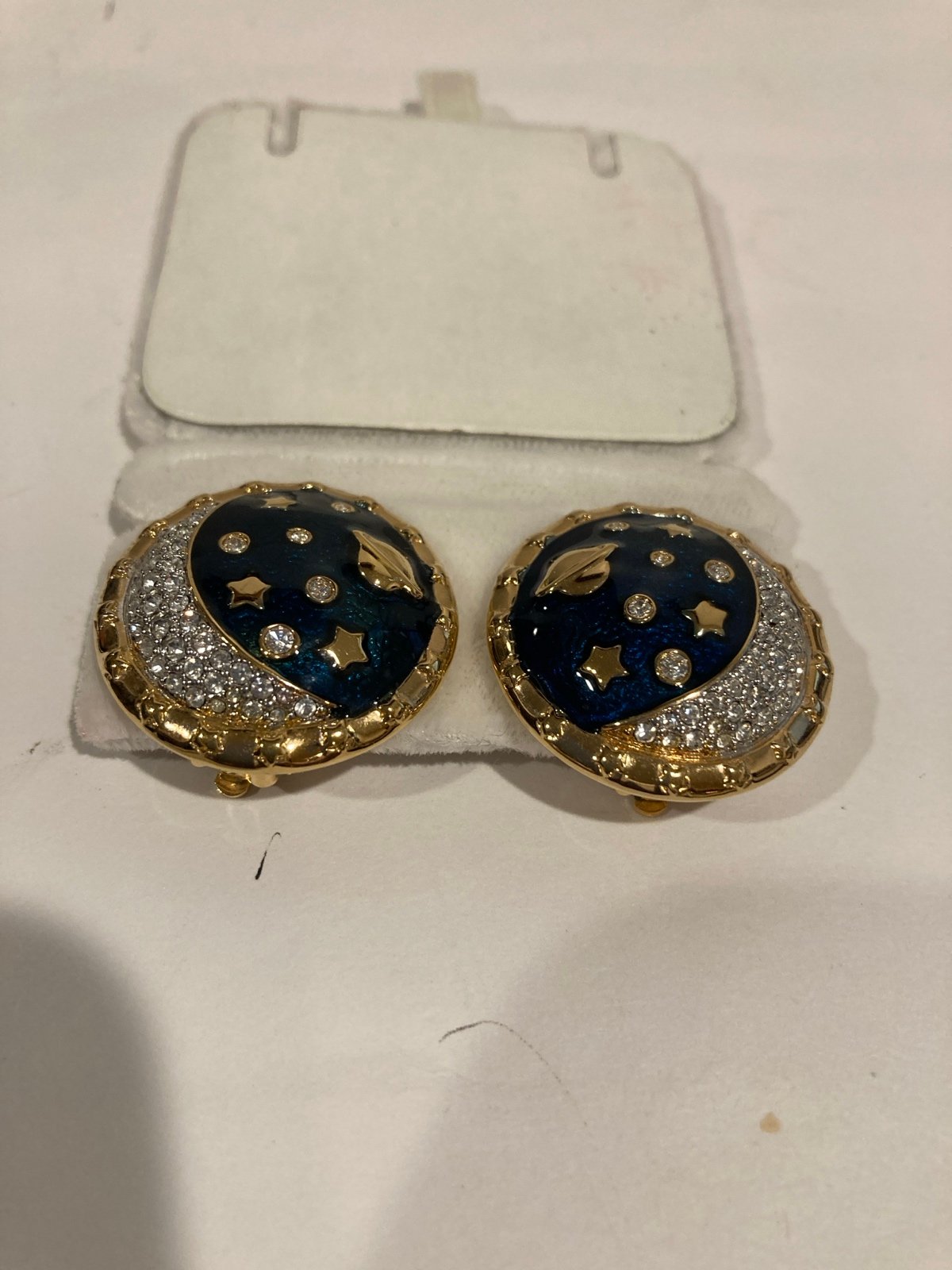Swarovski celestial star planet clip earrings.