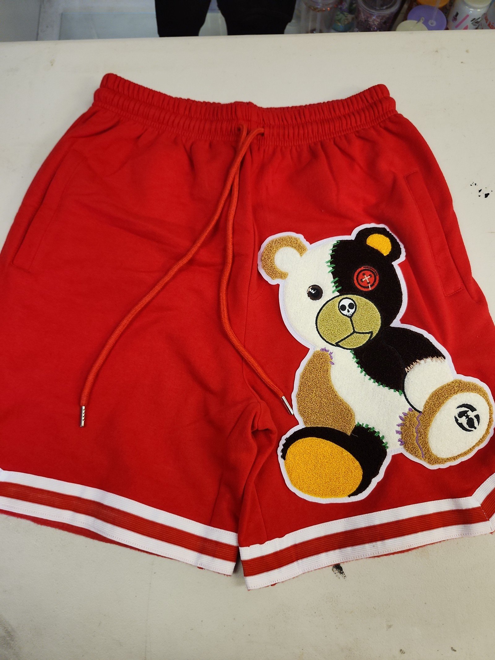 RED SHORTS WITH CHENILLE GRUDEN PATCH
