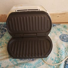 George Forman meat grilling machine
