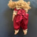 Porcelian Doll on rocking horse