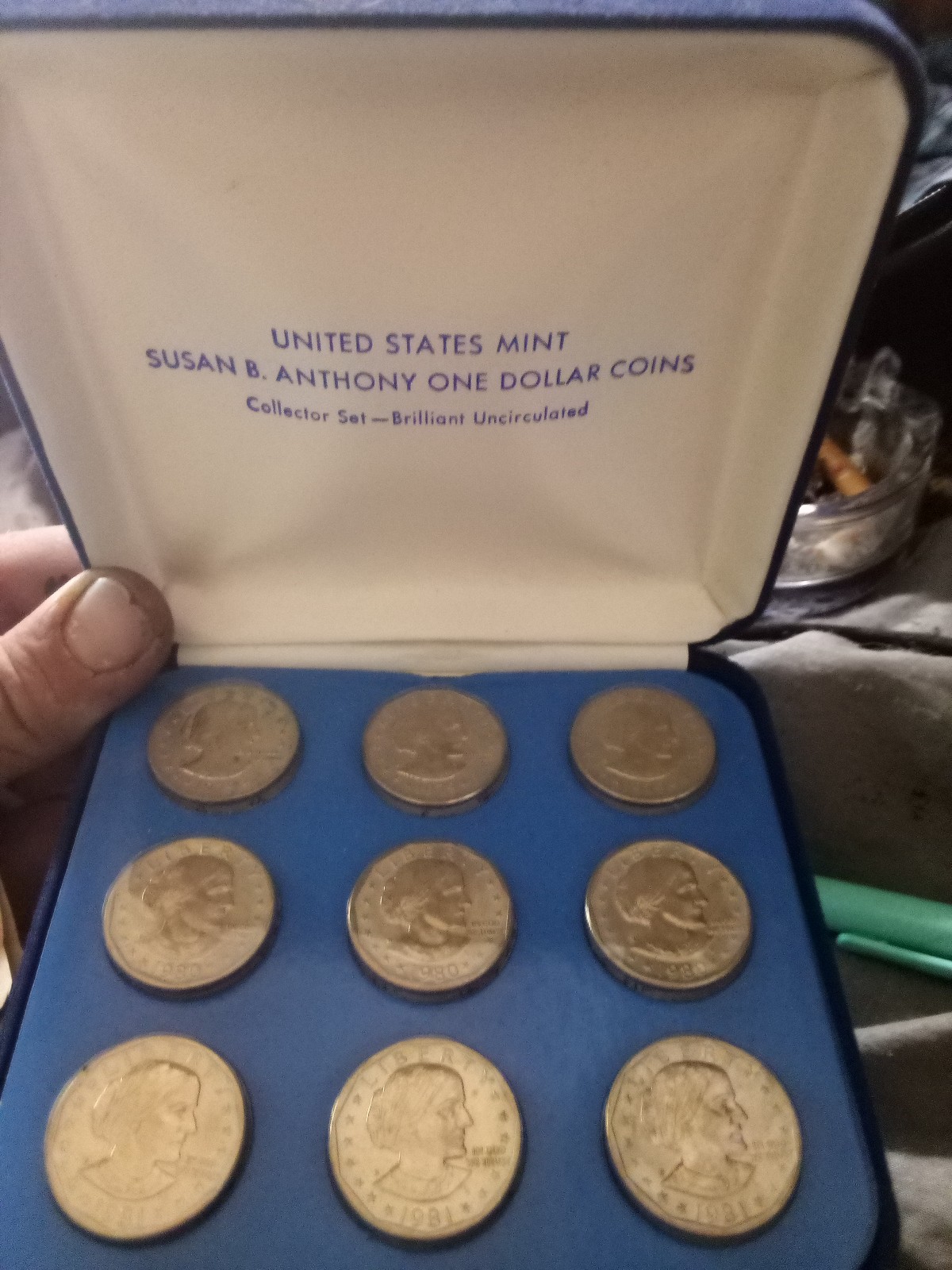 Susan b Anthony coins in case, 9 mint condition coins with certificate.