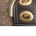 Coach wallet, tan and brown in color, gold tone hardware good condition. Measure