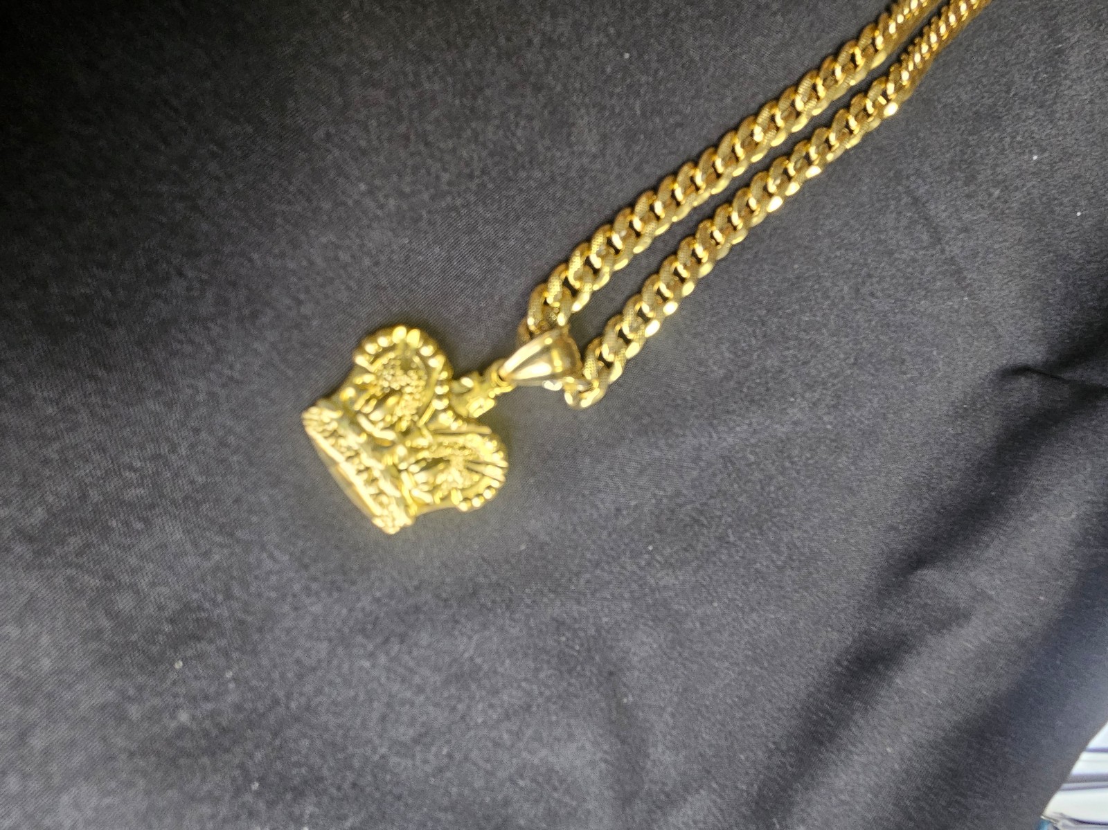 18K Gold 24 inch Cuban link, 1/4 thick with a Crown medallion.