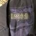LANVIN black pantsuit with a ribbon and flower embellishment.