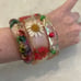 VINTAGE 1970's LUCITE BANGLES W/ ENCASED COLORFUL DRIED FLOWERS-FLOWER POWER!!!