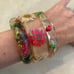 VINTAGE 1970's LUCITE BANGLES W/ ENCASED COLORFUL DRIED FLOWERS-FLOWER POWER!!!