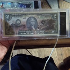 Authenticated uncirculated 2 Dollar bills